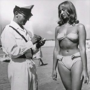 At first glance, it looks like a harmless photo of a woman on the beach – but look closer and you’ll see the hidden detail At first glance, it looks like a harmless photo of a woman on the beach – but look closer and you’ll see the hidden detail