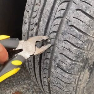 MY WIFE SAID HER CAR WAS ACTING WEIRD—SO I CHECKED AND FOUND A NAIL THE SIZE OF MY FINGER IN HER TIRE MY WIFE SAID HER CAR WAS ACTING WEIRD—SO I CHECKED AND FOUND A NAIL THE SIZE OF MY FINGER IN HER TIRE