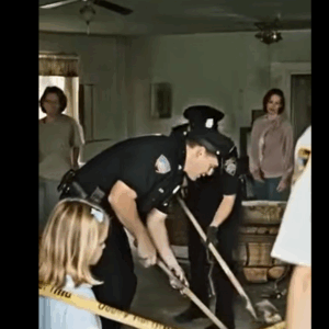 A girl alerted the police, claiming her father was trapped beneath the floor; when officers lifted the boards, they discovered a horrifying sight