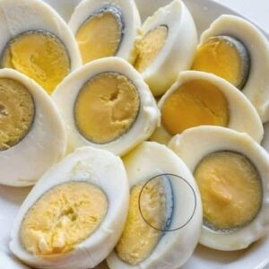 Why does a green ring appear around hard-boiled eggs?