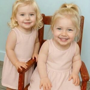 Young woman puts both babies inside the fir… See more